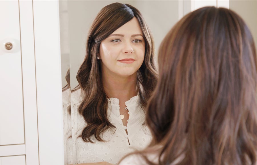 Erin-long-wig-looking-in-mirror